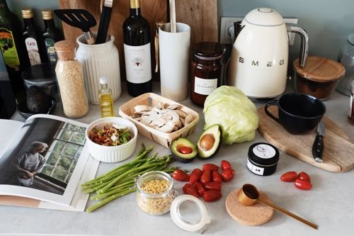 Fresh colorful vegetables and ingredients laid out for a healthy meal